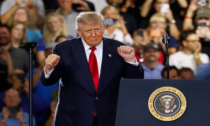 US President Donald Trump dances, as he delivers remarks on the economy, at the General Motors Proving Ground in Milford, Michigan. -- Reuters file