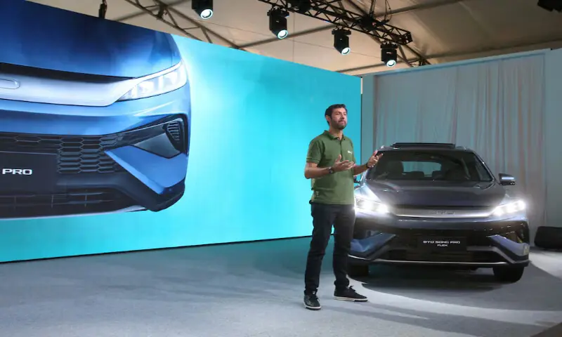 Alexandre Aquino, product director at BYD, speaks next to the the BYD Song Pro Flex vehicle during the launch of the Chinese automaker's first Brazilian-made plug-in hybrid flex-fuel car at an event in Sertaozinho, Sao Paulo state, Brazil. -- Reuters