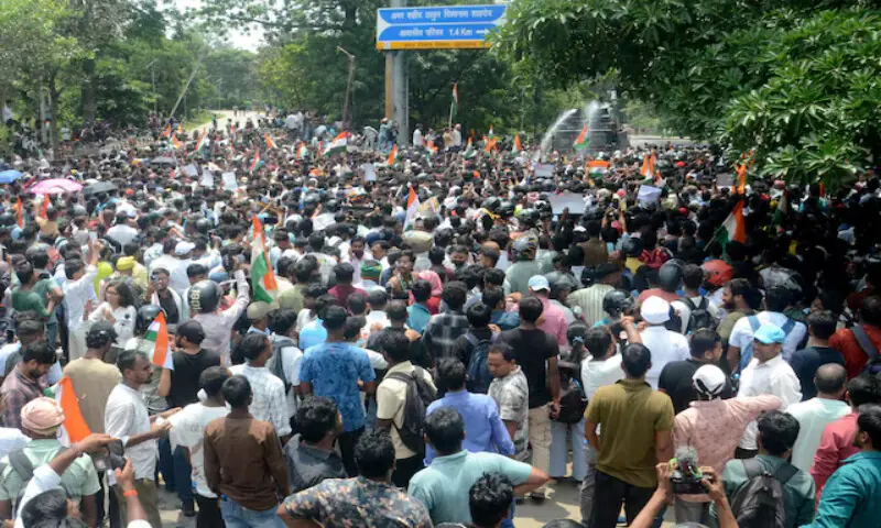 Demonstrators march on the state legislature as police use water cannons to disperse them during a protest against alleged irregularities in the state's civil services examinations in Ranchi, India, on Monday. -- Reuters