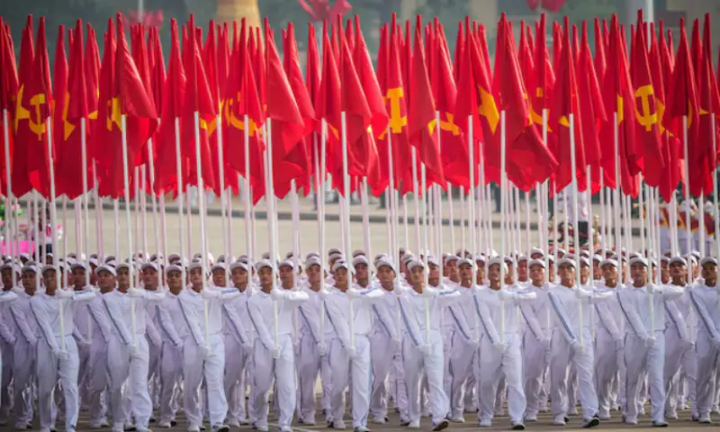 Vietnamese march with Vietnam National Flags takes part in a military parade marking Vietnam's 80th National Day anniversary in Hanoi, Vietnam. -- Reuters