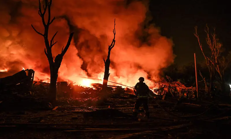 A firefighter works at the site of a car garages of residents which were hit by an overnight Russian missile strike, amid Russia's attack on Ukraine, in Zaporizhzhia, Ukraine. -- Reuters