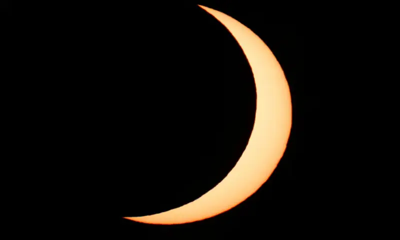 The moon partially covers the sun following a total solar eclipse as seen from Arija, Spain. -- Reuters