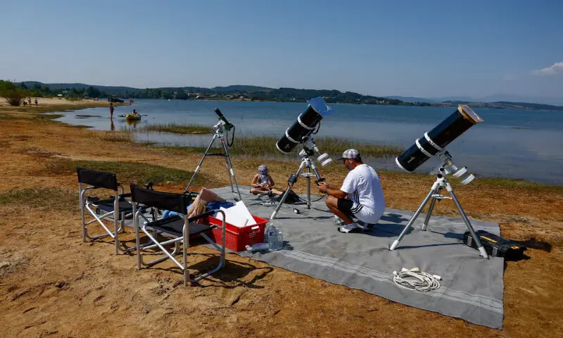 Frenchman Leyssalle Anthony, 39, prepares a telescope to view the total solar eclipse from the beach, in Arija, Spain. -- Reuters