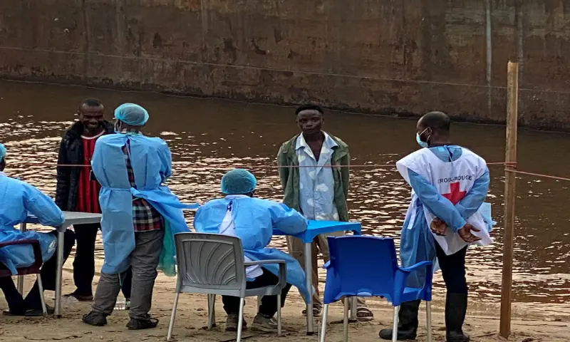 Passengers who disembarked from a boat intercepted by health authorities wait to be tested following the death of a passenger suspected of having Ebola, in Kinshasa, Democratic Republic of the Congo. -- Reuters