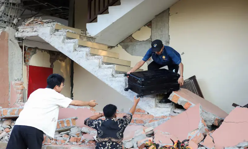 People evacuated from a building collapse at Jayakarta hotel following an earthquake in Labuan Bajo, East Nusa Tenggara, Indonesia. -- Reuters