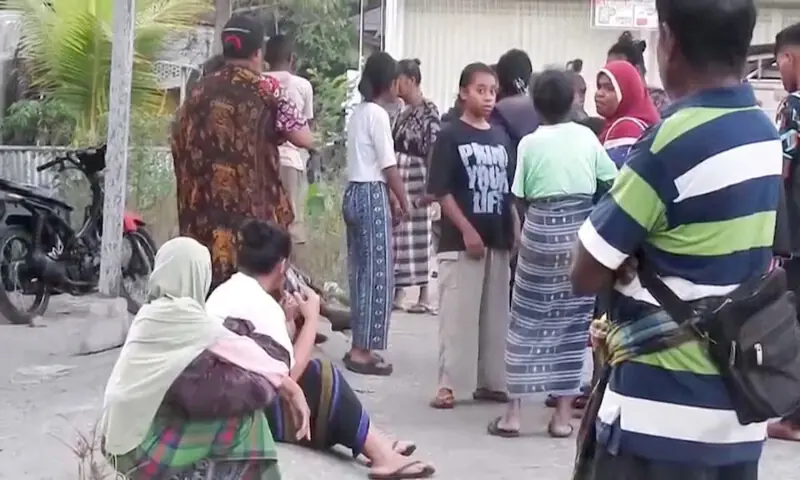 Villagers outside their homes following an earthquake in Talibura, Easu Nusa Tenggara, Indonesia. -- Reuters
