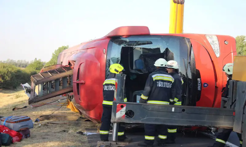 Firefighters and emergency workers at the scene of a deadly accident near Mezokeresztes, Hungary, on Sunday. -- Reuters