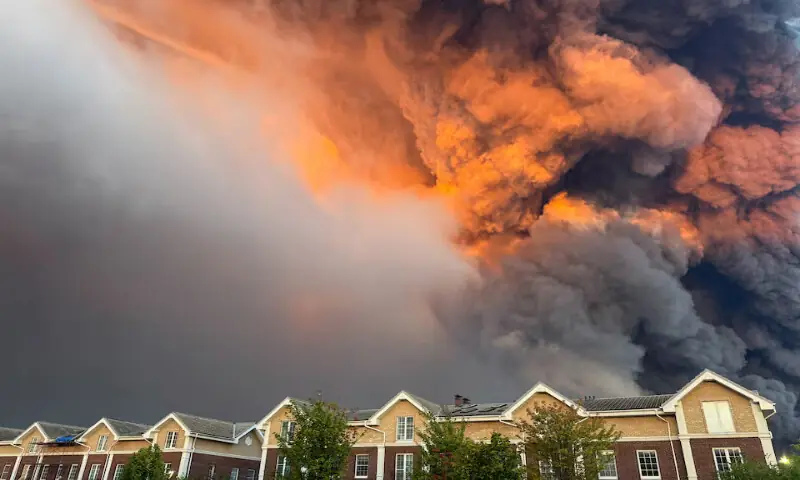 Smoke billows from the burning Wildberries warehouses following a Ukrainian drone attack in Koledino, Moscow Region, on Sunday. -- Reuters