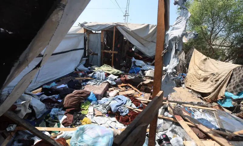 Palestinians inspect the site of an Israeli strike on a tent in Khan Younis in the southern Gaza Strip. -- Reuters