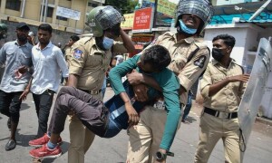 One dead in India unrest over military hiring, some gatherings banned