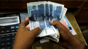 Rupee gains against dollar, closes at 204.56
