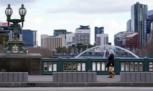 Australians urged to work from home as winter Omicron wave swamps hospitals