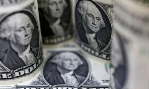 Dollar hits 20-year high as Fed flags higher rates for longer