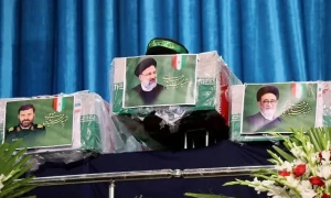 Tens of thousands gather for Raisi funeral procession in Tehran