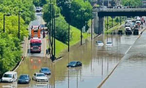 Torrential rains flood Toronto, causing power outages, traffic disruption
