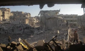 Israeli strikes kill 15 Palestinians in Gaza school, nine West Bank militants