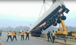 Trailer plunges into canal while avoiding motorcyclist on National Highway