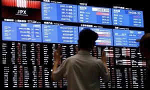 Japan’s Nikkei hits new peak as automakers benefit from yen decline