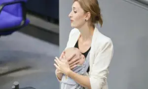 German MP makes history by delivering budget speech with baby in carrier