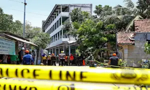 Indonesian rescuers race against time to save students trapped under collapsed school