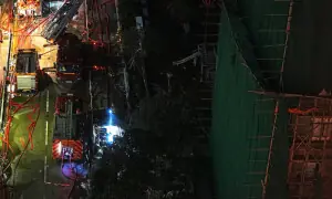 Anger rises in Hong Kong as deadly high-rise fire sparks petitions and arrests