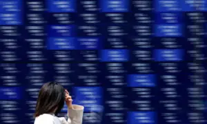 Stocks slide in Asia as metals melt down, earnings loom