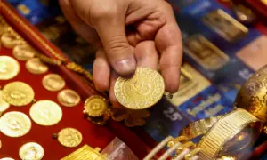Gold, silver gain in volatile trade; CME hikes margins again