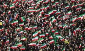 Funeral turns defiant as Iranians vow to fight on