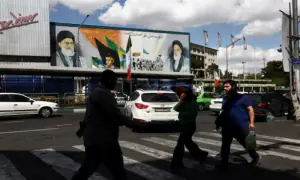 Trump says US forces will stay near Iran, warns of renewed action