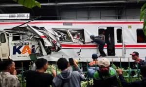 Train crash near Jakarta kills 14, dozens trapped as rescue continues
