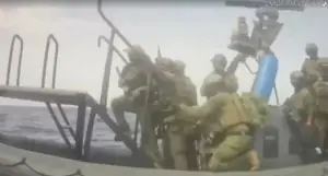 Gaza aid flotilla says Israeli forces boarded a vessel
