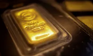 Gold rises on weaker dollar, easing oil as investors assess US-Iran deal prospects