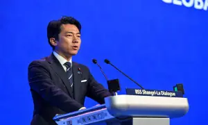 Japan rejects 'new militarism' label, accuses China of rapidly arming