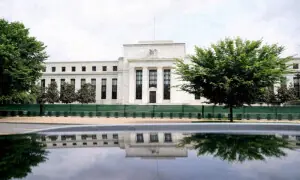 Fed holds rates steady, raises inflation expectations