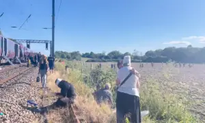 One killed and several injured in train collision north of London, police say