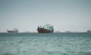 Hormuz traffic crawls after strike on vessel; ships shun Omani corridor