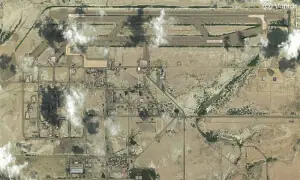 Iran reports strikes on two military sites; US denies new attacks