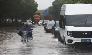 Typhoon Dolphin's vast storm system pushes inland, threatens central China